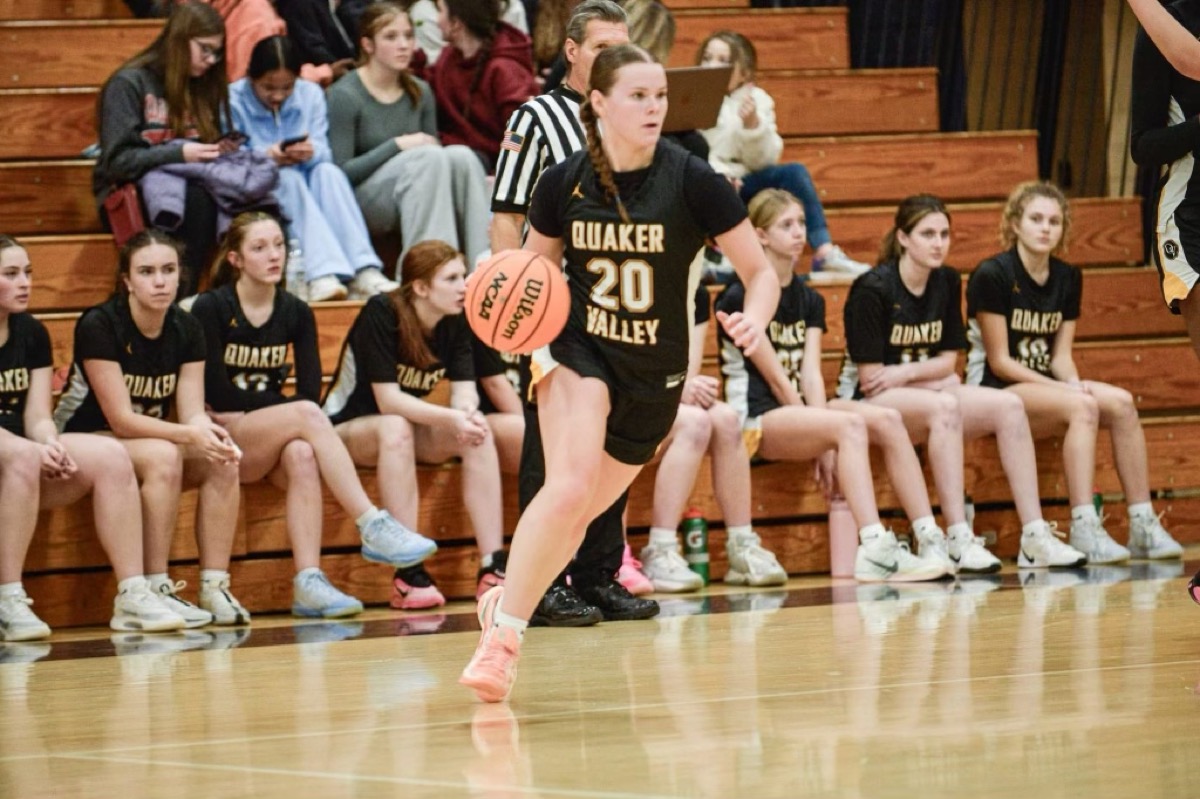 QV player #20 bringing the ball up the court during a game