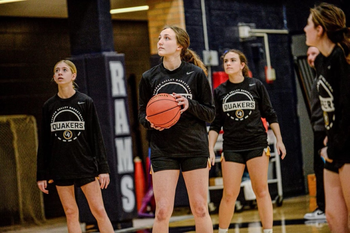 QV players warming up before an away game